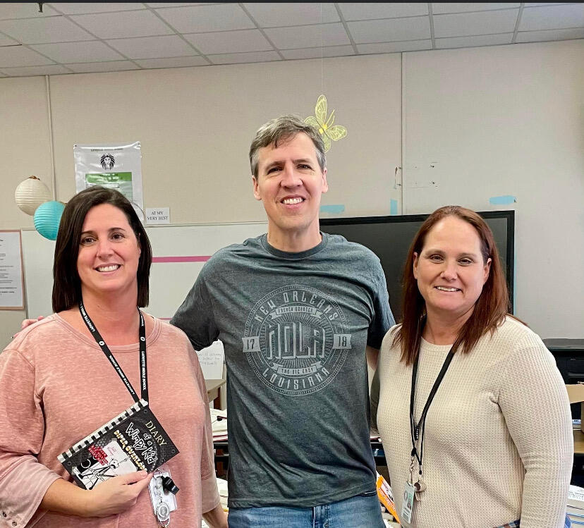 Mrs. Felts and Ms. Brodnax poses with Jeff Kinney