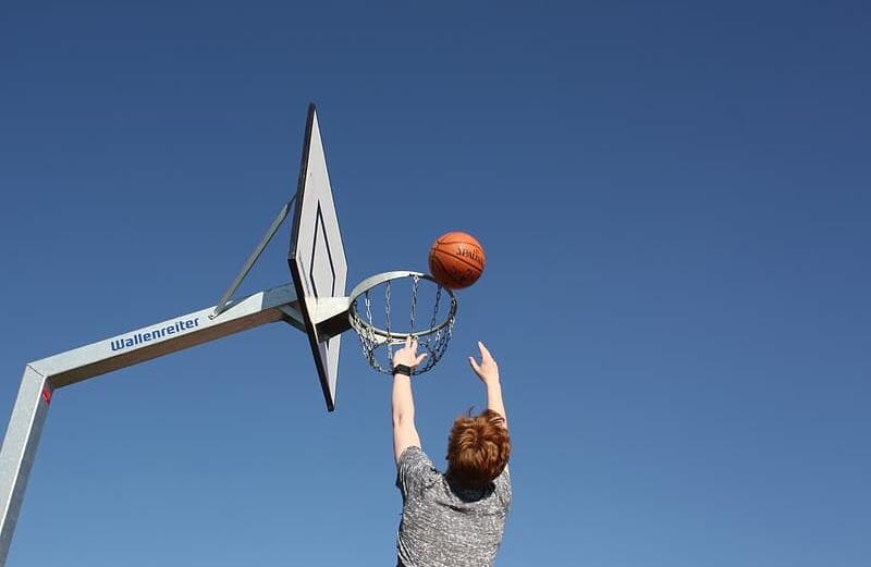 A student tossing a basketball